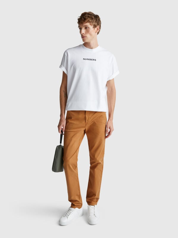 Chinos slim fit em algodão Homem