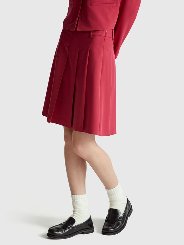 Minissaia com pregas Mulher