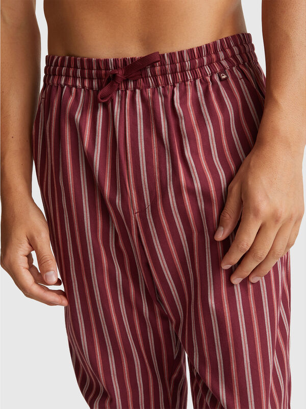 Calças às riscas Homem