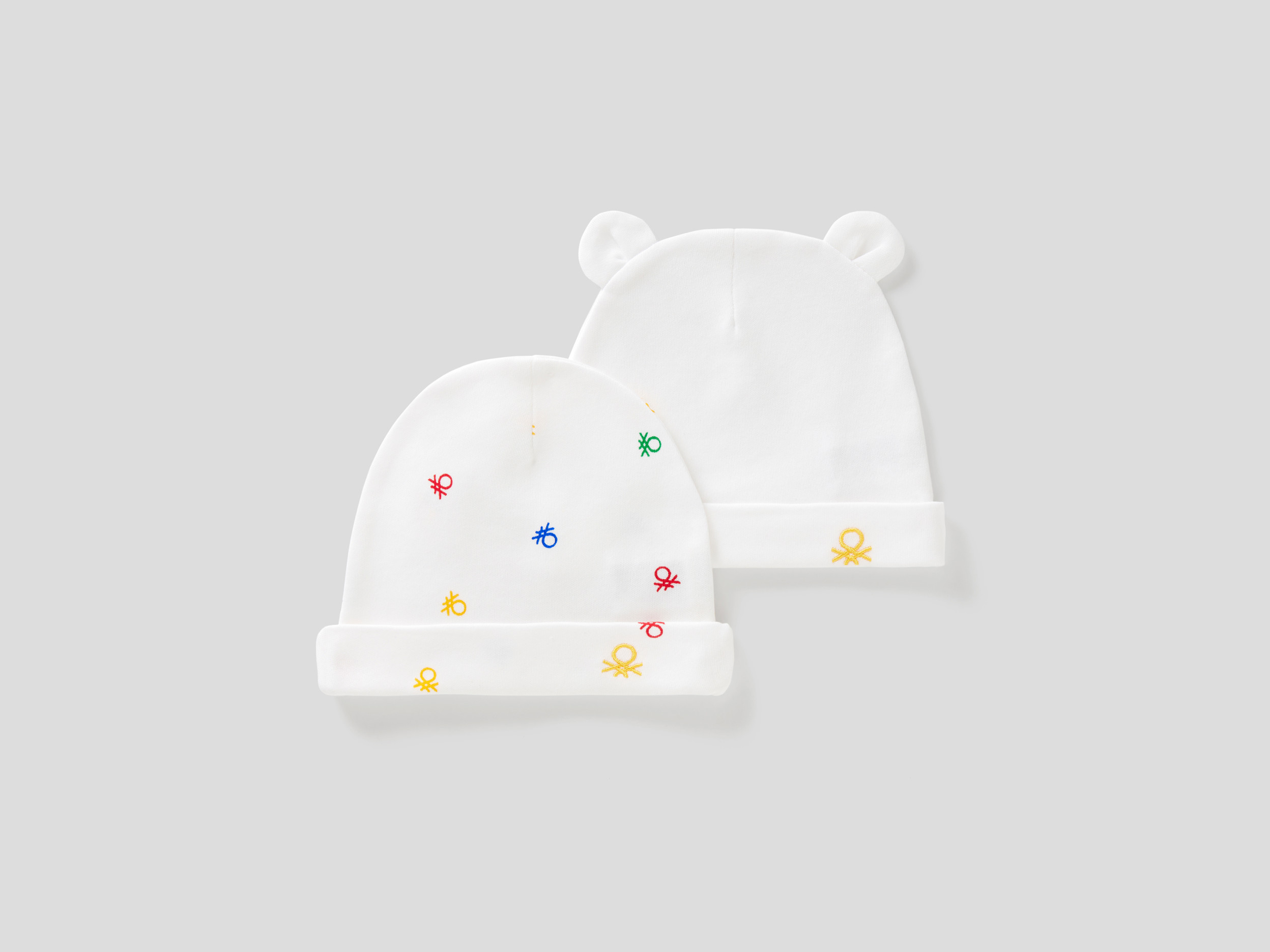 Benetton, Due Cappellini In 100% Cotone Biologico, Bianco, Bambini Benetton, Due Cappellini In 100% Cotone Biologico, Bianco, Bambini